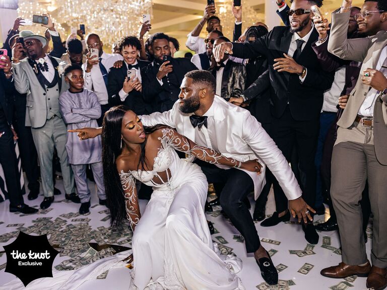 Chiney and husband Raphael doing the money dance at their wedding reception