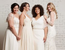 group of women wearing Rebecca Schoneveld wedding dresses. 