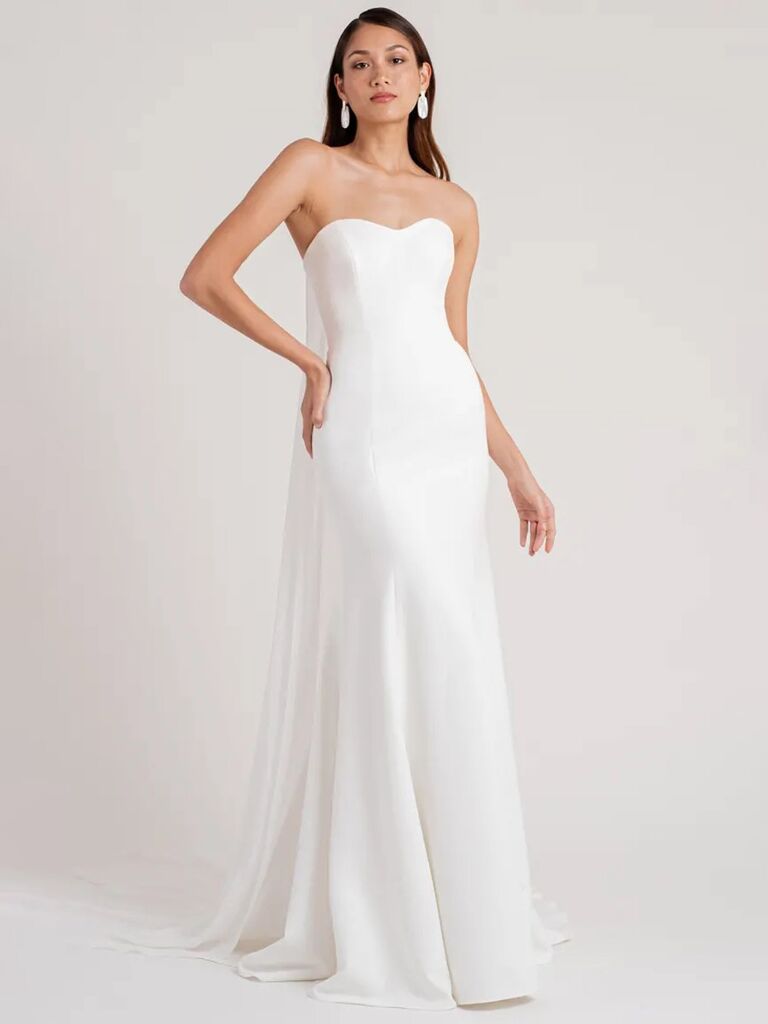 jenny yoo plain white strapless wedding dress with sweetheart neckline detachable back cape and form fitting pleated flowy skirt