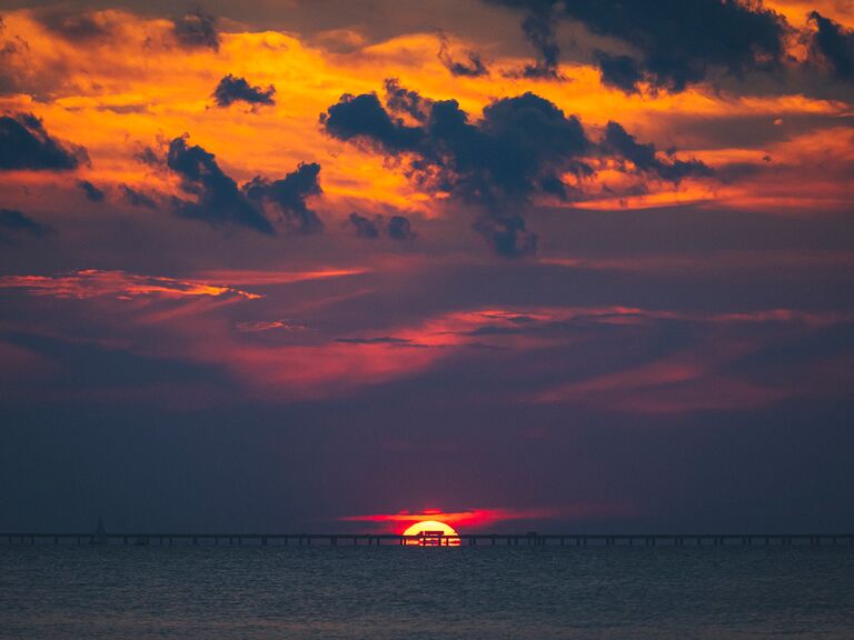 The sun sets over the water along the coast of Louisiana