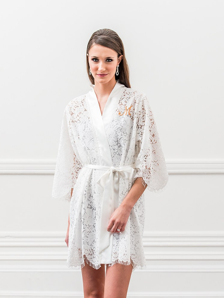 A model wears this white Customized Lace Wedding Robe, with a tie at the natural waist.