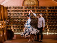 Couple dancing in wine cellar engagement party venue
