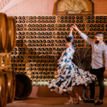 Couple dancing in wine cellar engagement party venue