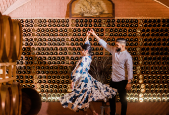 Couple dancing in wine cellar engagement party venue