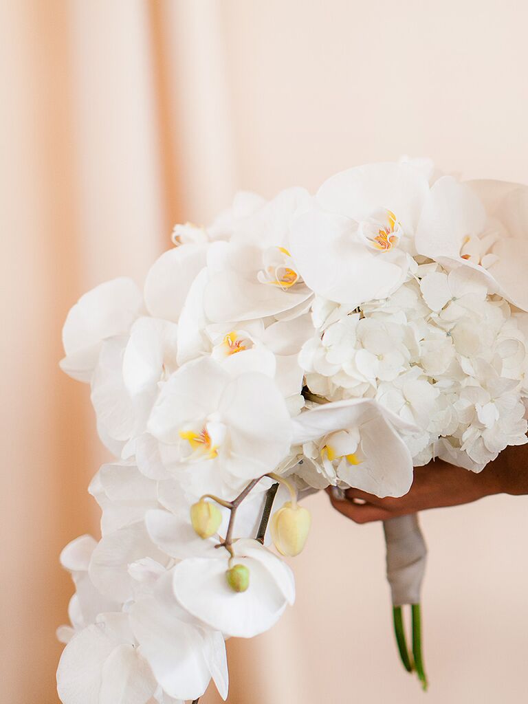 Cascading white bouquet with hydrangeas and orchids