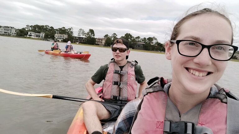 During the vacation, we kayaked in the marsh and saw dolphins in the wild!