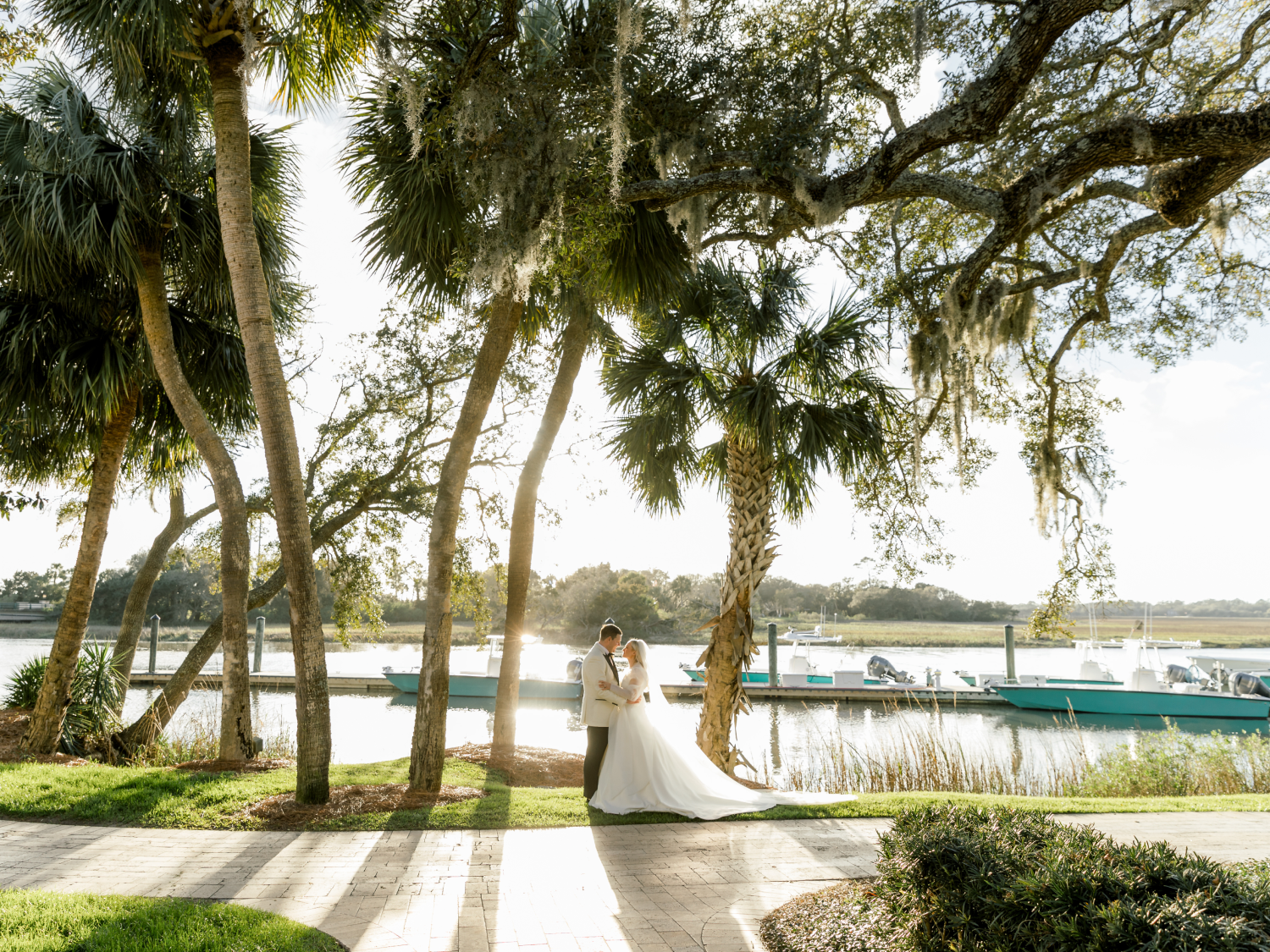 bride and groom under palm trees and spanish moss in the Golden Isles, Georgia