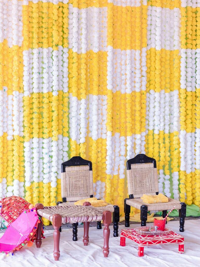 yellow-and-white haldi ceremony backdrop