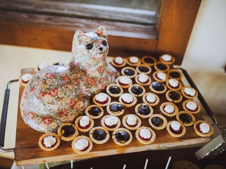 cat figurine on wedding dessert table