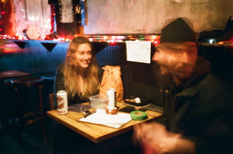 Kate and Bob met at Daddy's bar in Bushwick with both their respective instruments attached to their backs. This is a picture from a different bar in Brooklyn called Matchless, where Bob worked the door for shows.