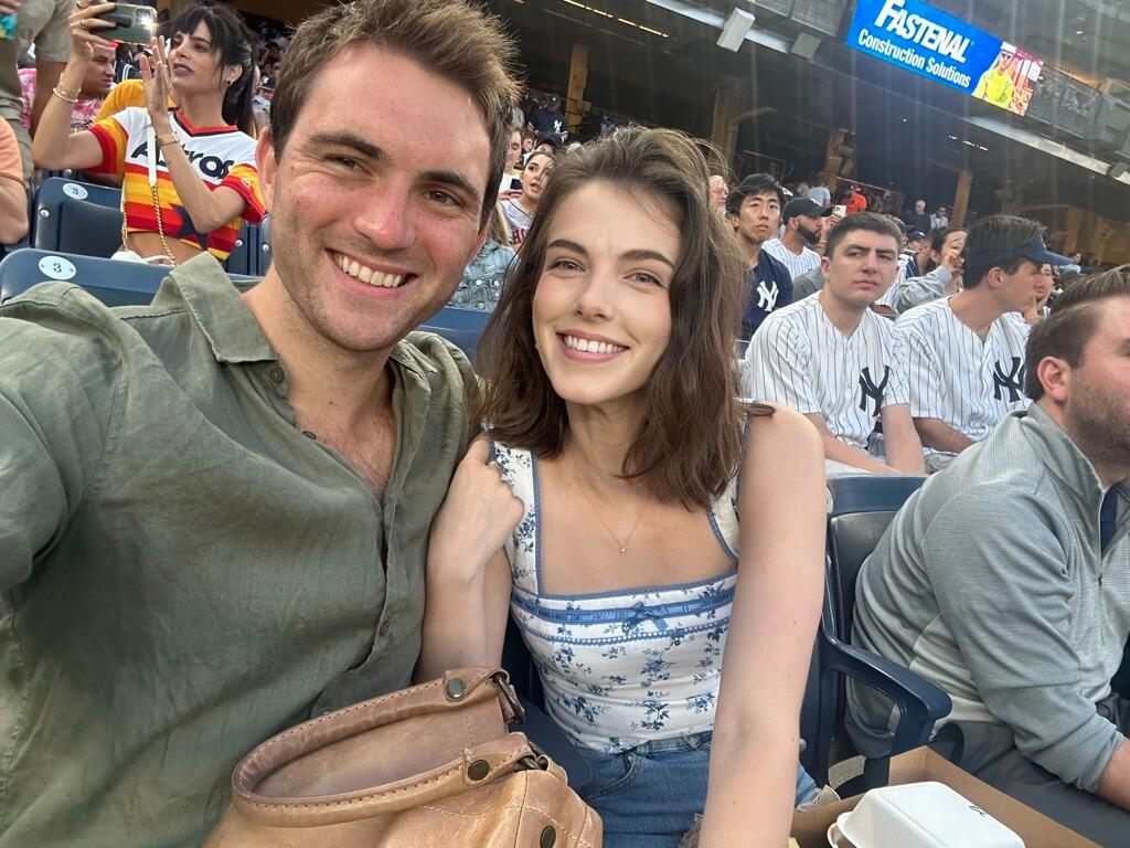 We both ended up in New York while pursuing our careers. We loved exploring the city together and making new memories. This was taken at Yankee Stadium. 