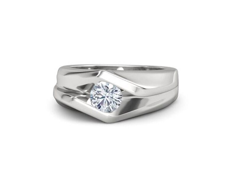 gemvara round cut engagement ring with round moissanite center stone and thick sterling silver band with jagged detailing