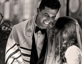 Couple getting married in a Jewish ceremony