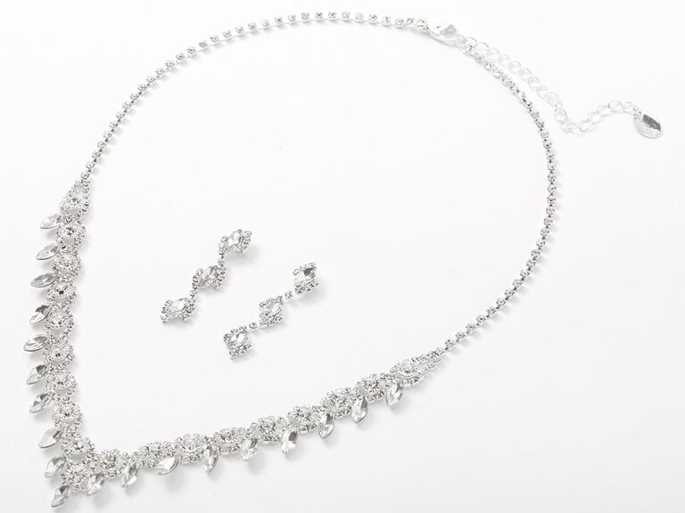 A clear rhinestone necklace and earrings set with a leafy design and dangle earrings from Claire's
