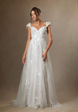 Moonstone is our bridal gown that embodies an ethereal and romantic look. She features a V-neckline with illusion tulle cap sleeves embellished with floral lace applique, that trails down to the A-line skirt with a hint of sparkle. We designed this with a low illusion V-back and a chapel length train for added drama as you walk down the aisle.