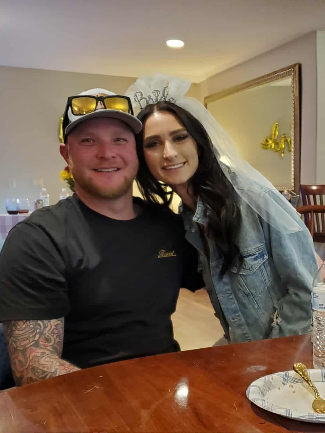 Lukas surprises Katie with flowers at her bridal shower.