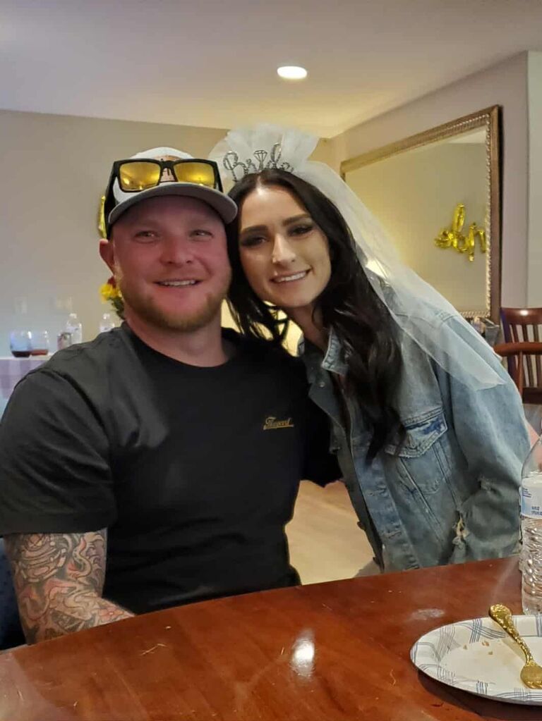 Lukas surprises Katie with flowers at her bridal shower.