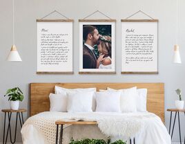 Three hanging frames with photo in center, vows in black type on white canvas sign