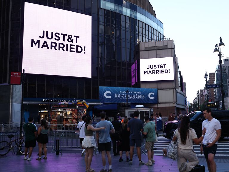 Madison Square Garden billboards reading "JUST&T MARRIED!"