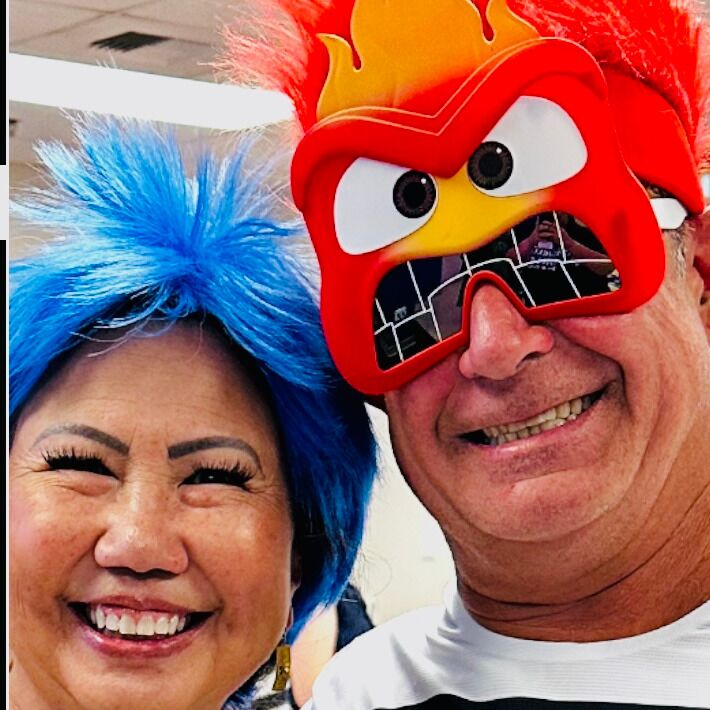 Dressing up as Joy and Anger from "Inside Out" to serve the students at the CSUSB Palm Desert Campus Movie Night.  