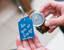Traditional wedding gift for groom: watch with note