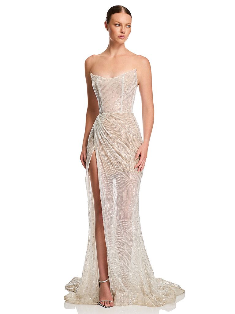 White mermaid-inspired strapless wedding dress by KYHA. 