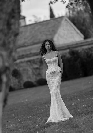 Mermaid silhouette dress with a minimalist, beaded-strapped top. The corset’s waistline is accentuated by a peplum. The dress is fully crafted from meticulously sequined guipure lace, adding refined detail.