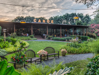 The sun sets on the tranquil setting of Canoe, where benches wait for visitors to stay awhile.