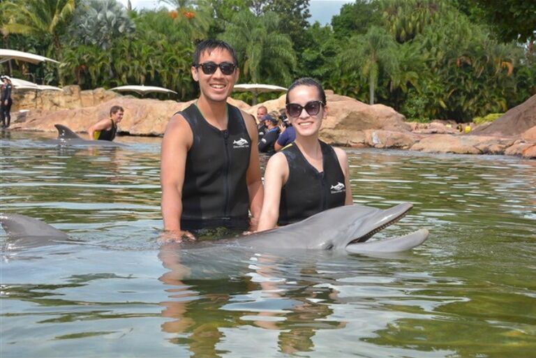 Swimming with dolphins at Discovery Cove in FL and the most expensive photo we ever paid for!
