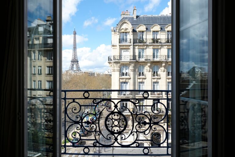 A view of the Eiffel tower from an open window in Paris, France