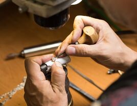 Man fixing a diamond in his workshop