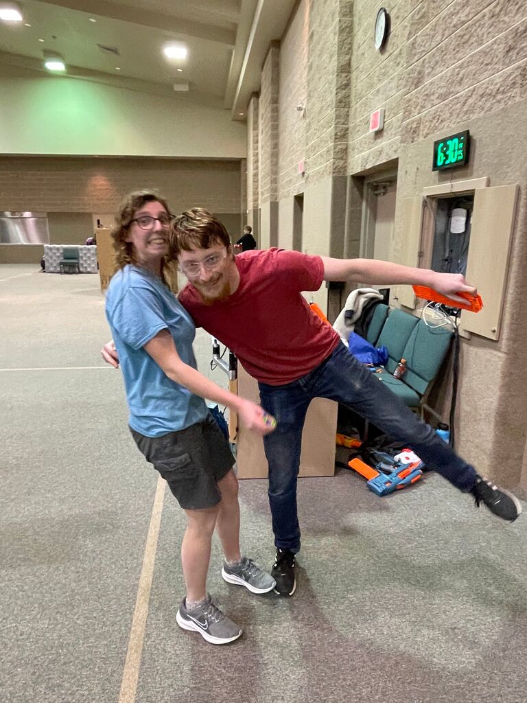 His posing didn't work too well... (but she didn't fall to the ground, this time)