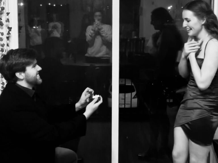 He proposes in her Slippery Rock apartment- take note of the reflections of the roommate support group supplying champagne, photos, nails, and shock therapy.