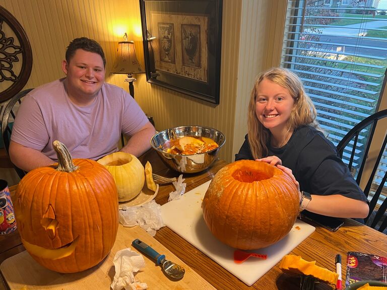 Carving pumpkins.