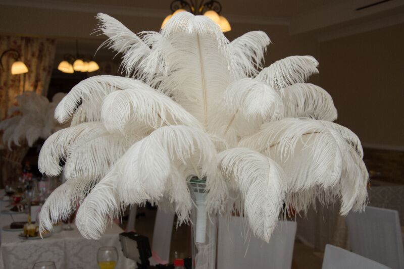 Old Hollywood theme party idea - white feather centerpieces