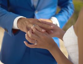 Couple wearing wedding rings