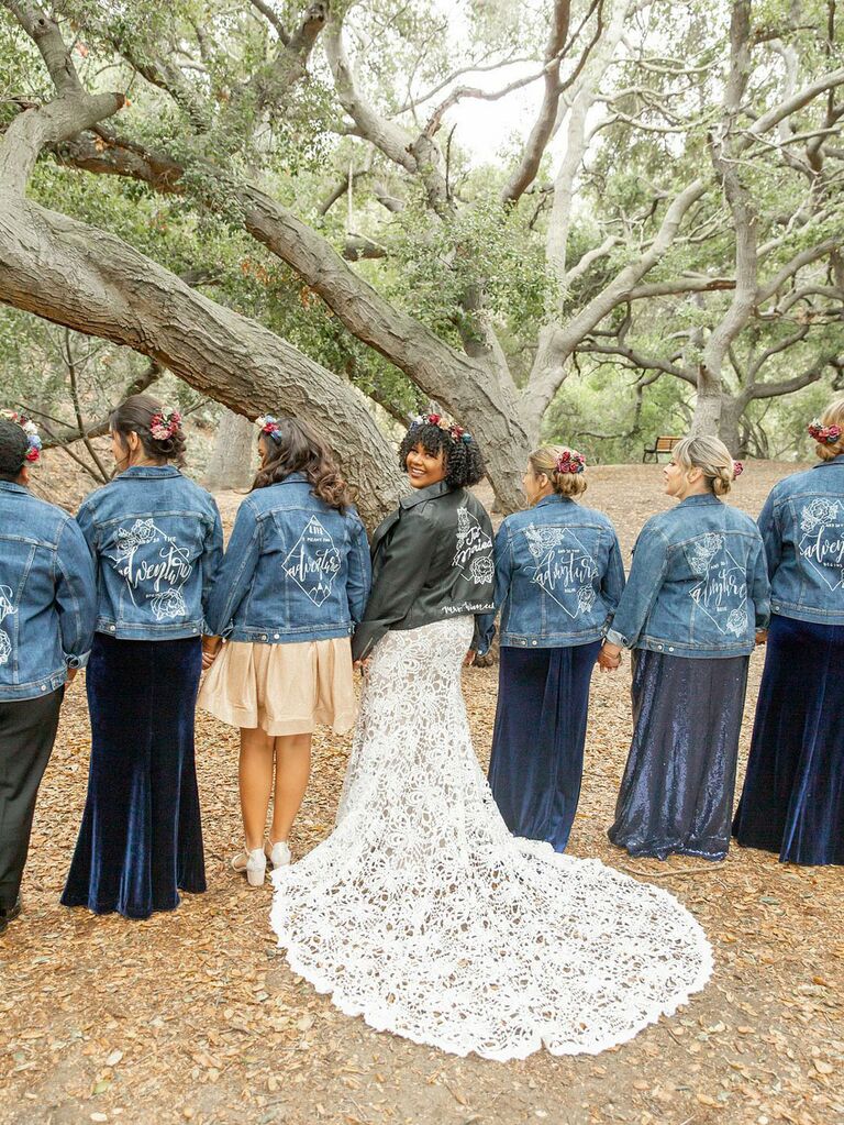 Bridesmaids wearing matching custom wedding denim jackts