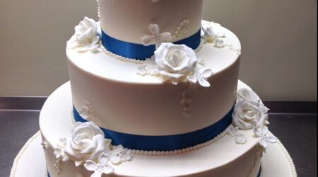 Elegant White Butter Cream Wedding Cake with a Louis Vuitt…