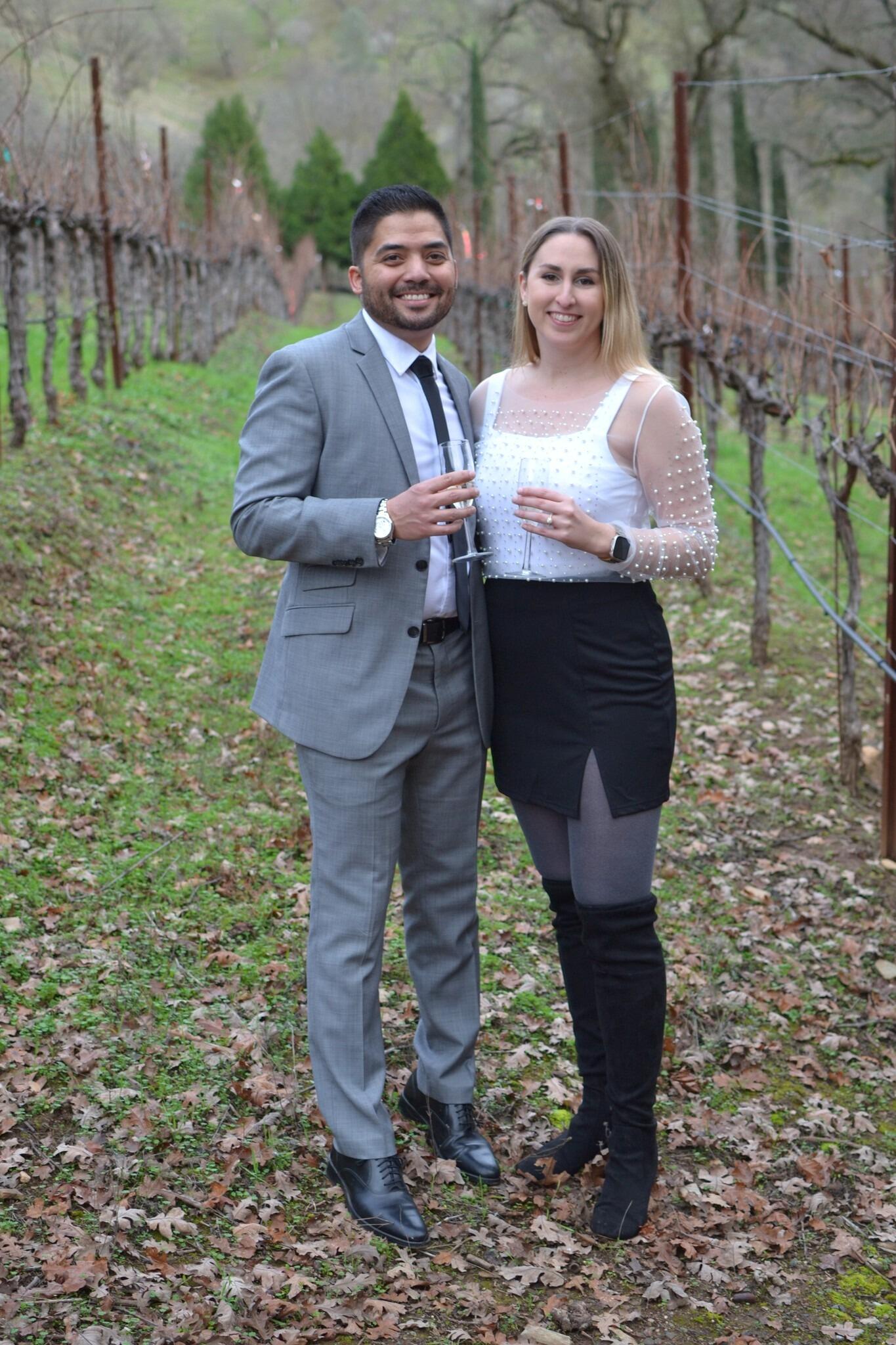 The proposal. For the past twelve or so years, Brian and his college friends have planned a trip for NYE to various parts of California. This time was the third year Meagan tagged along with the group. We rented a gorgeous AirBnb on a private vineyard in Placerville, CA. During the trip, we channeled our inner Bob Ross with landscape paintings, competed in Beer-lympics, and explored the beautiful property. However, right before sundown on NYE, our group of friends gathered for another friendly game: a scavenger hunt. At least, that's what Meagan thought. It turns out, Brian (with the help of his WONDERFUL friends) had something else planned entirely. While the members of Meagan's "team" searched throughout the house for clues -  and kept her thoroughly distracted - Brian and his team went upstairs to search for their first "clue," grabbed supplies, and ran 
outside to set up for a surprise proposal. When Meagan found her team's last clue, it led her outside to the vineyard, where Brian was waiting at the bottom of a candle-lined stairway. He got down on one knee, popped the question, and champagne was poured! 