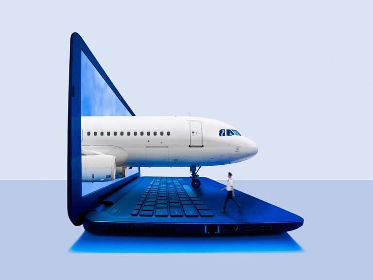 plane comes through a laptop screen and couple holds up the aircraft signifying strength of travel agents
