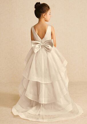 We encourage all our flower girls to feel like the princess they are while wearing Pumpkin. Made from matte satin and tulle, she features a scoop neckline, a bow tie belt, a ruched A-line silhouette, and a tiered tulle skirt trimmed with horsehair. This dress is not only perfect for a flower girl at a wedding but also versatile enough for other special occasions.
