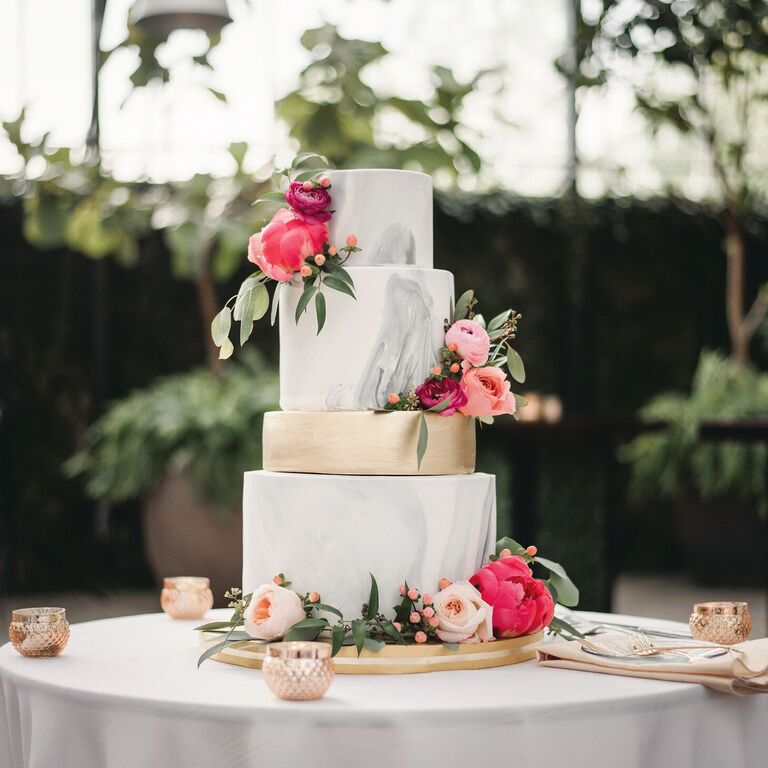 Four-tier gray marbled cake with pink peony decorations