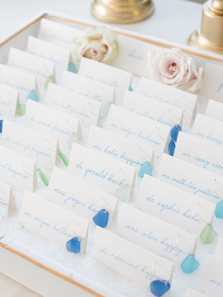 Escort cards with sea glass wine charms