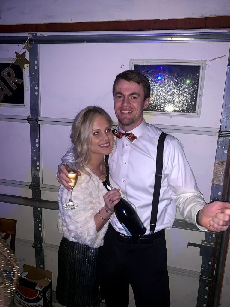 Our first New Year's Eve together! Our friends Kai and Matt hosted a roaring 20's theme party. This photo was snapped right before the champagne cork popped and brushed right past Shannon's hair/eye (yikes)!!