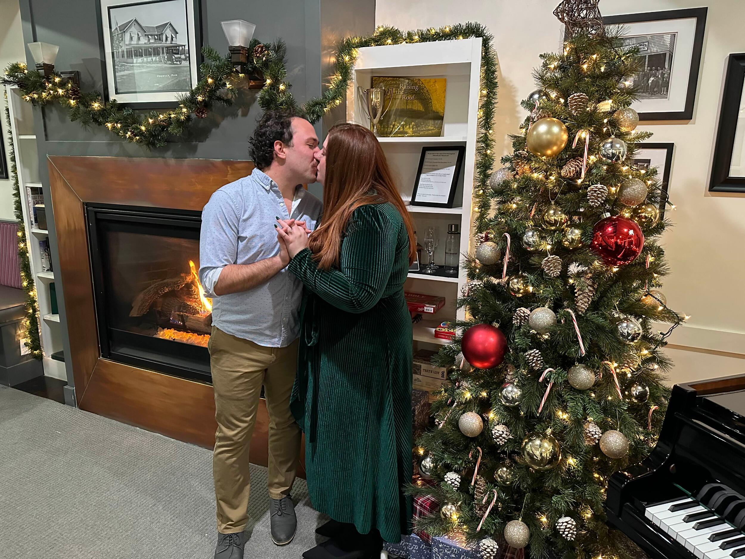 David pops the question three years to the day after they met in person! They are celebrating their anniversary in Saugatuck, Michigan, when he gets down on one knee in a gazebo surrounded by snow and Christmas lights. 