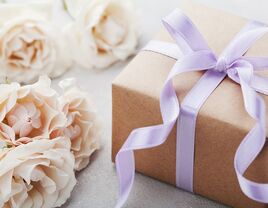 Simple gift box with purple ribbon