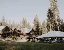 Outside view of the cabin venue and event tent at The Ninemile Creek Lodge