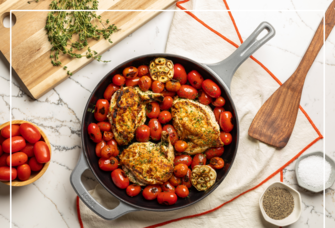 chicken and tomato recipe in enamel skilllet