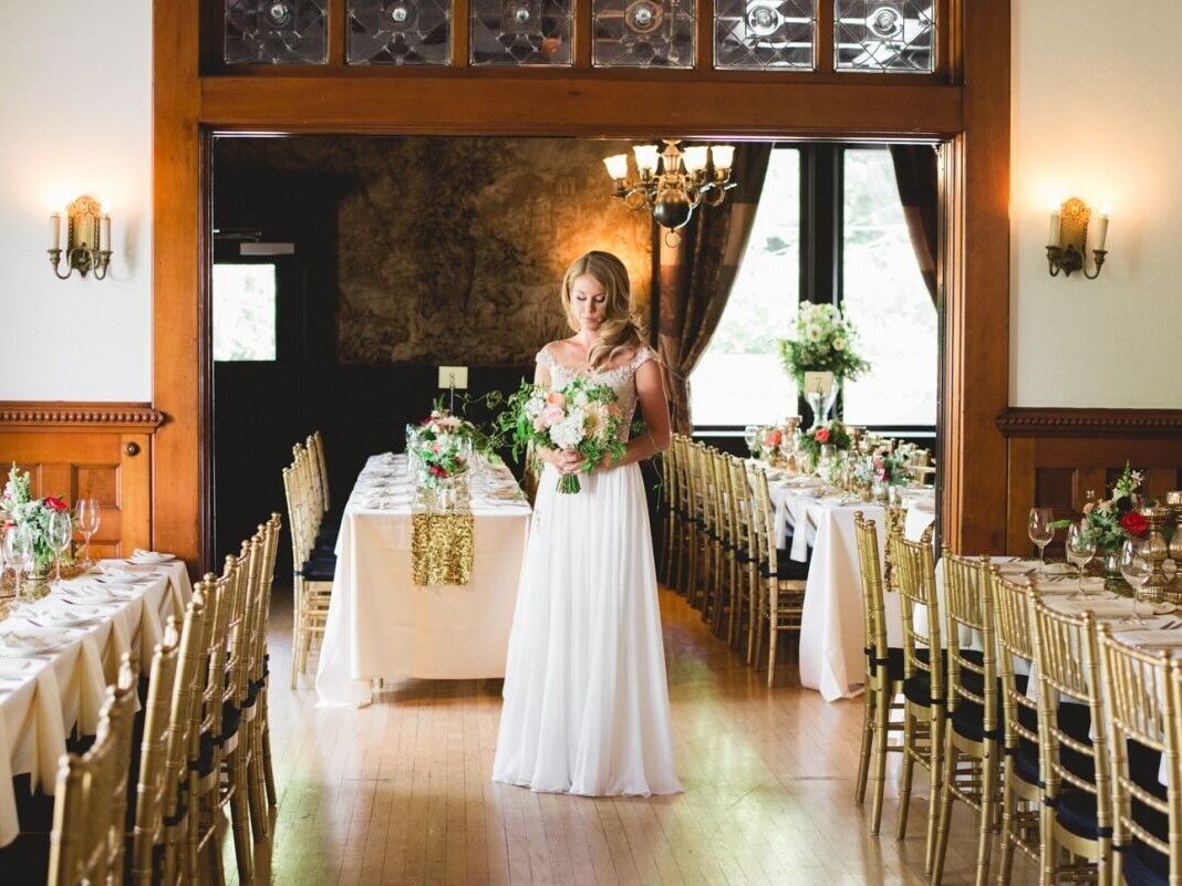 Bride standing in the middle of the cozy reception space