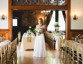 Bride standing in the middle of the cozy reception space